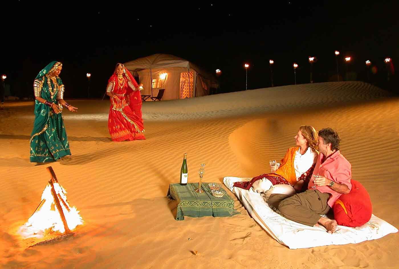 Camels on the Sam sand dunes in the Thar Desert at sunset